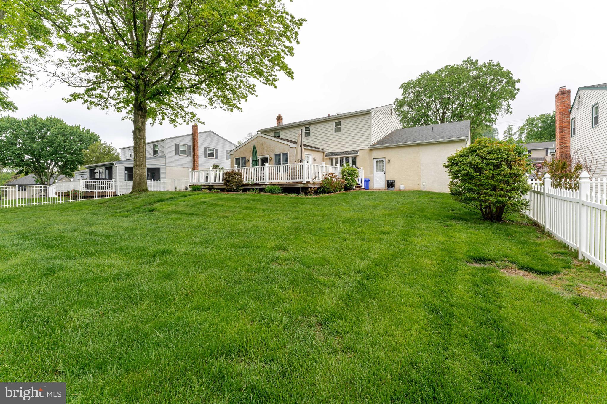 209 Beechtree Drive Broomall, PA 19008 - Photo 59 of 61 a view of a white house in front of a big yard with large trees