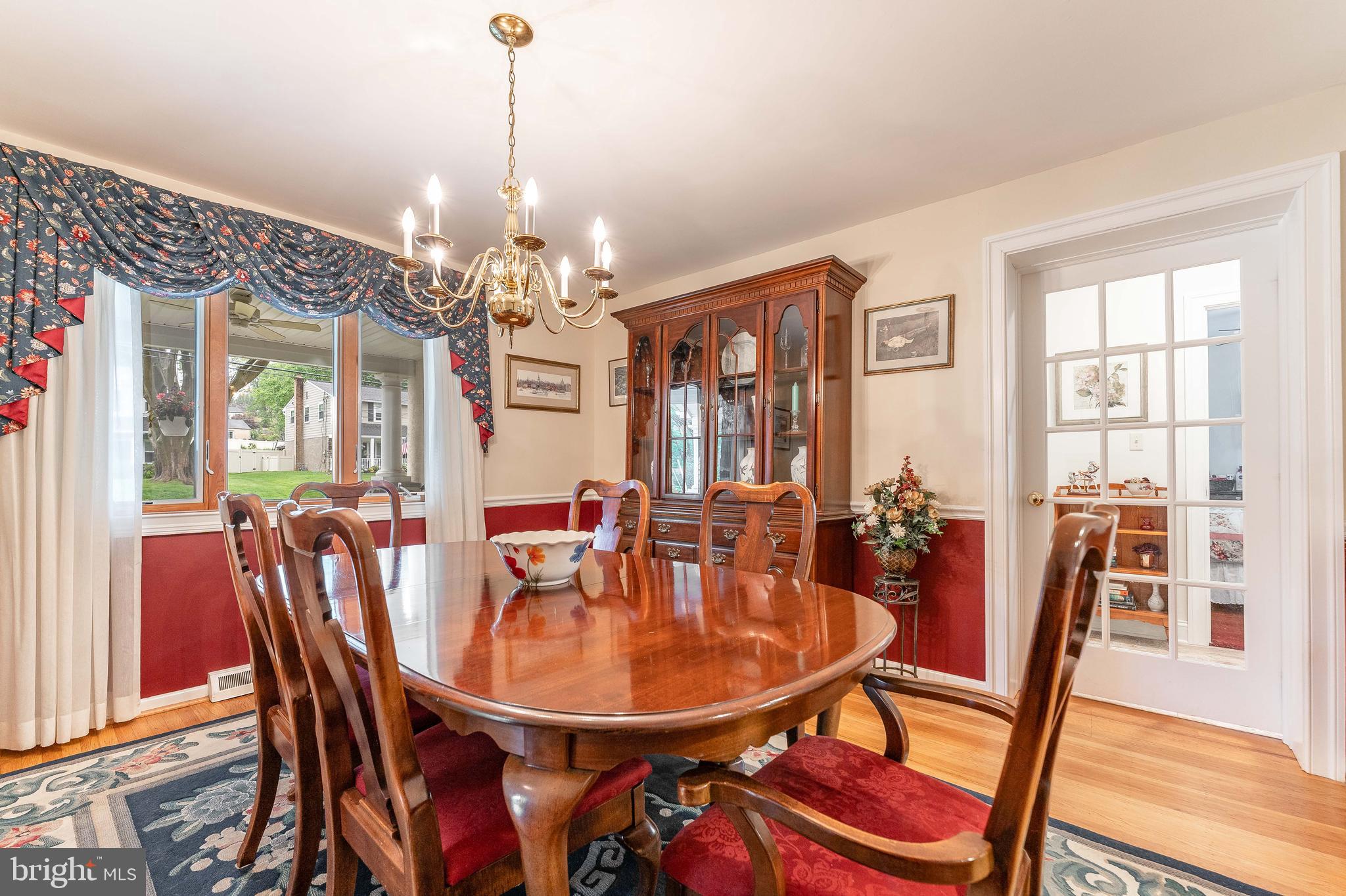 209 Beechtree Drive Broomall, PA 19008 - Photo 10 of 61 a dining room with furniture a chandelier and wooden floor