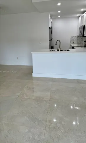 a bathroom with a sink a mirror and a shower