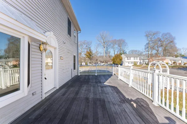 a view of a balcony with wooden floor