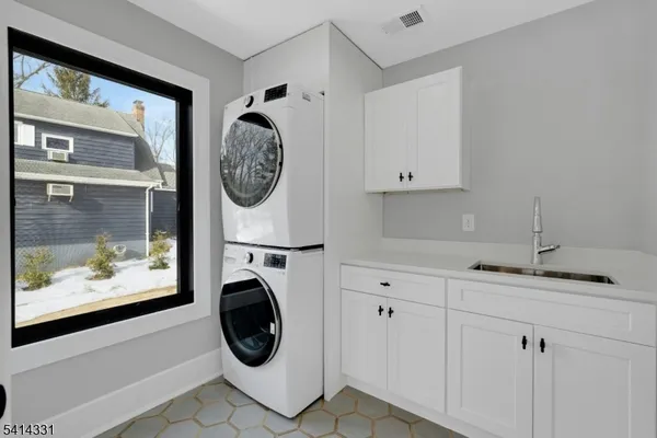 a view of living room with washer and dryer