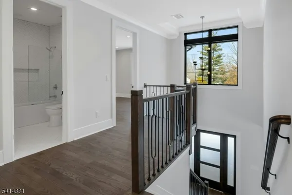 a view of hallway with windows