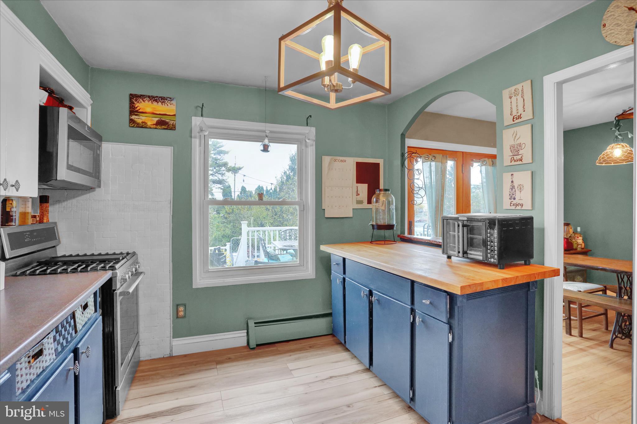 3 Cedarwood Road Reading, PA 19610 - Photo 13 of 34 a kitchen with stainless steel appliances granite countertop a stove a sink dishwasher and a refrigerator with wooden floor