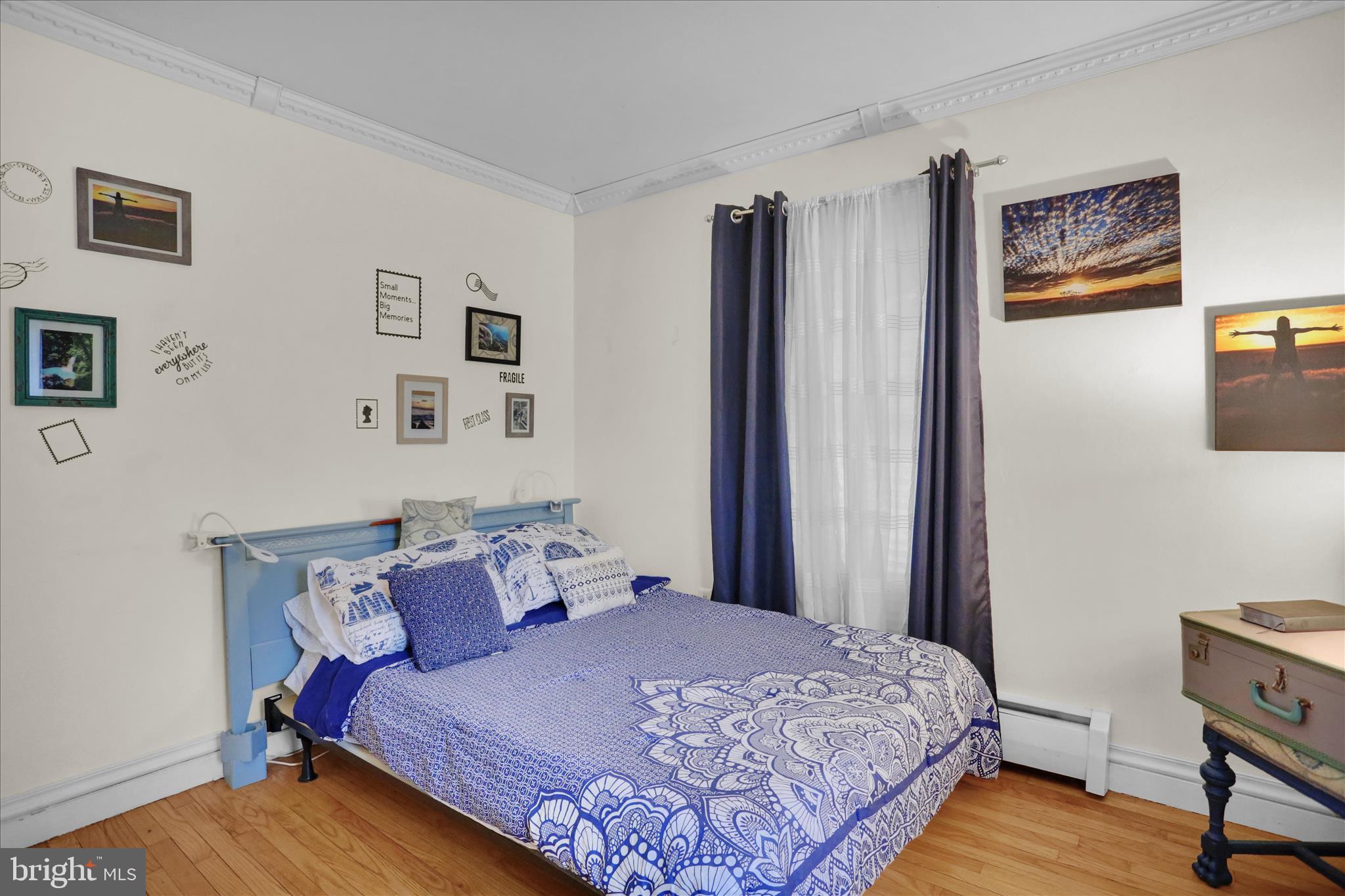 3 Cedarwood Road Reading, PA 19610 - Photo 17 of 34 a bedroom with a bed and wooden floor