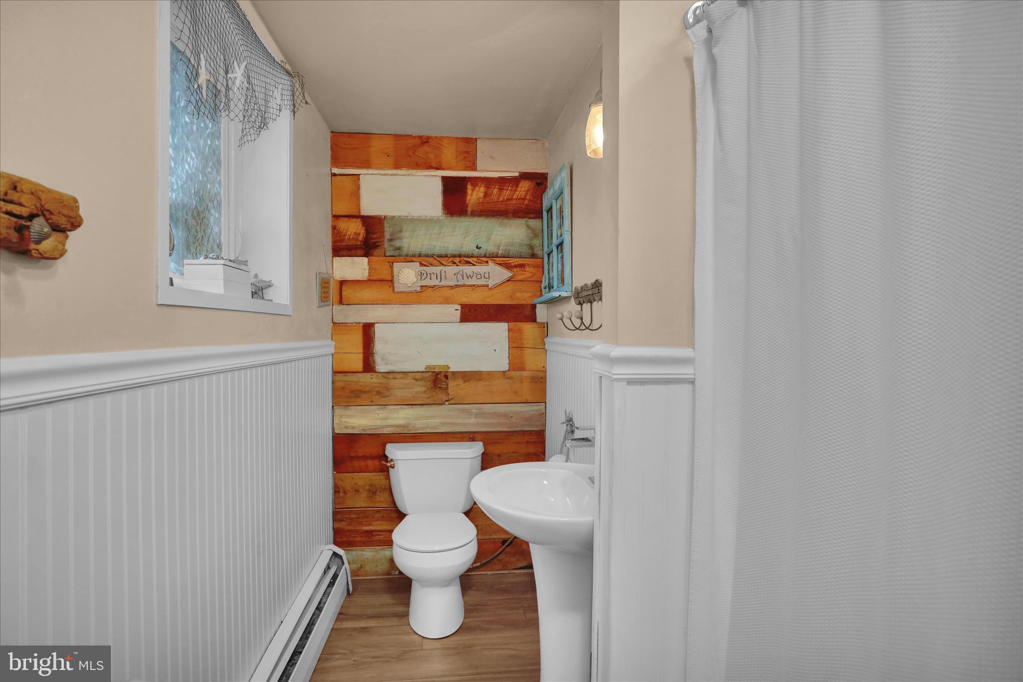 3 Cedarwood Road Reading, PA 19610 - Photo 26 of 34 a white toilet sitting next to a shower curtain