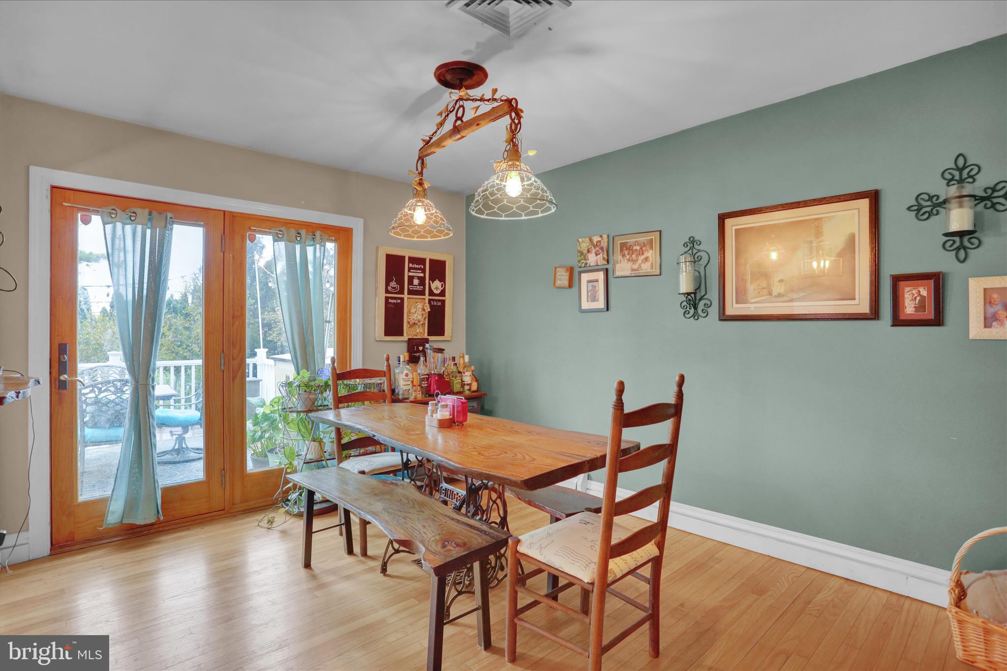 3 Cedarwood Road Reading, PA 19610 - Photo 7 of 34 a view of a dining room with furniture wooden floor and chandelier