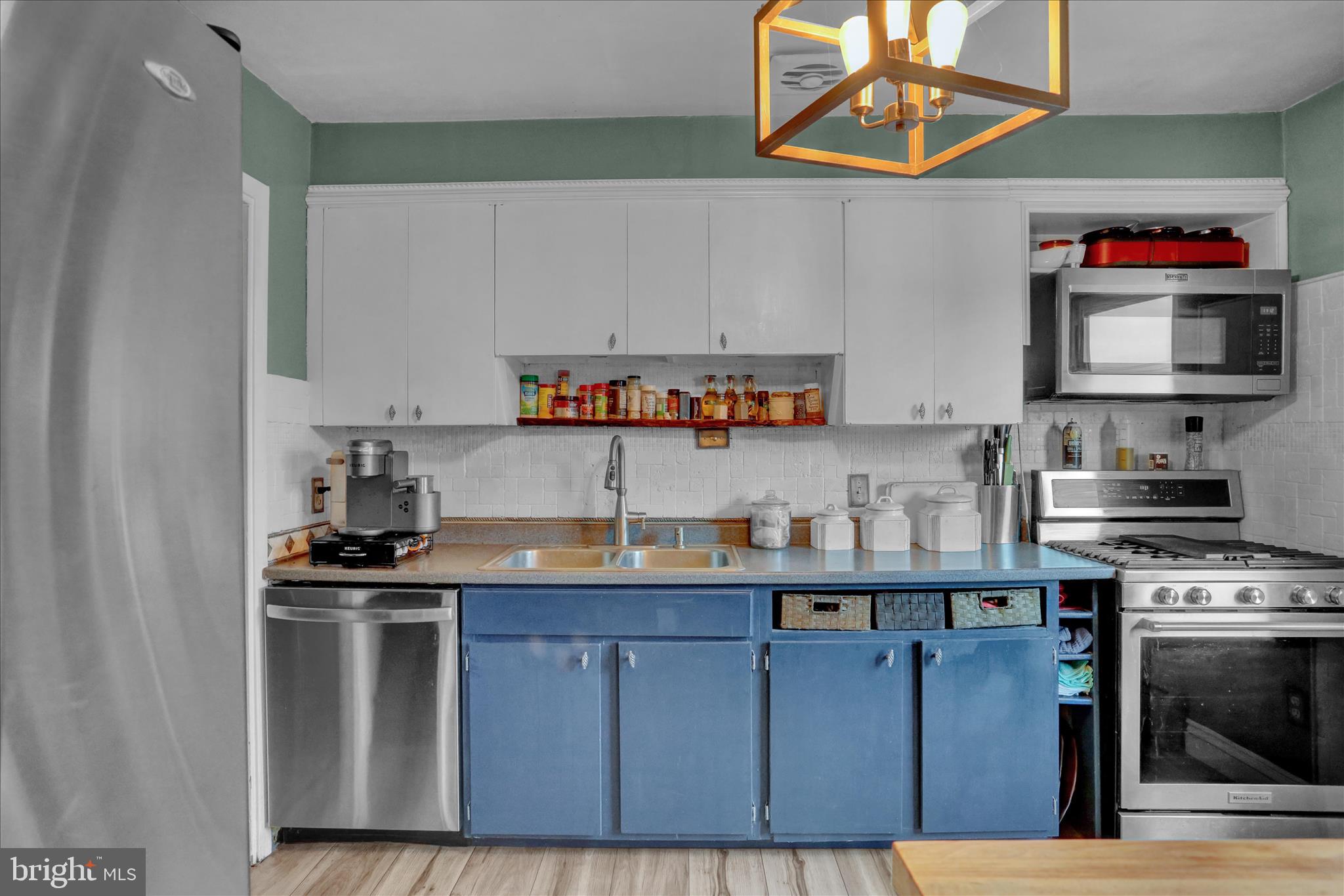 3 Cedarwood Road Reading, PA 19610 - Photo 10 of 34 a kitchen with stainless steel appliances granite countertop a stove and a sink