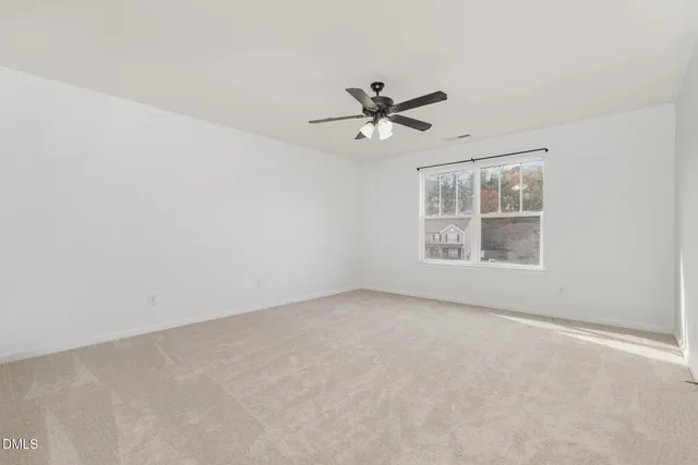 a view of a big room with carpet