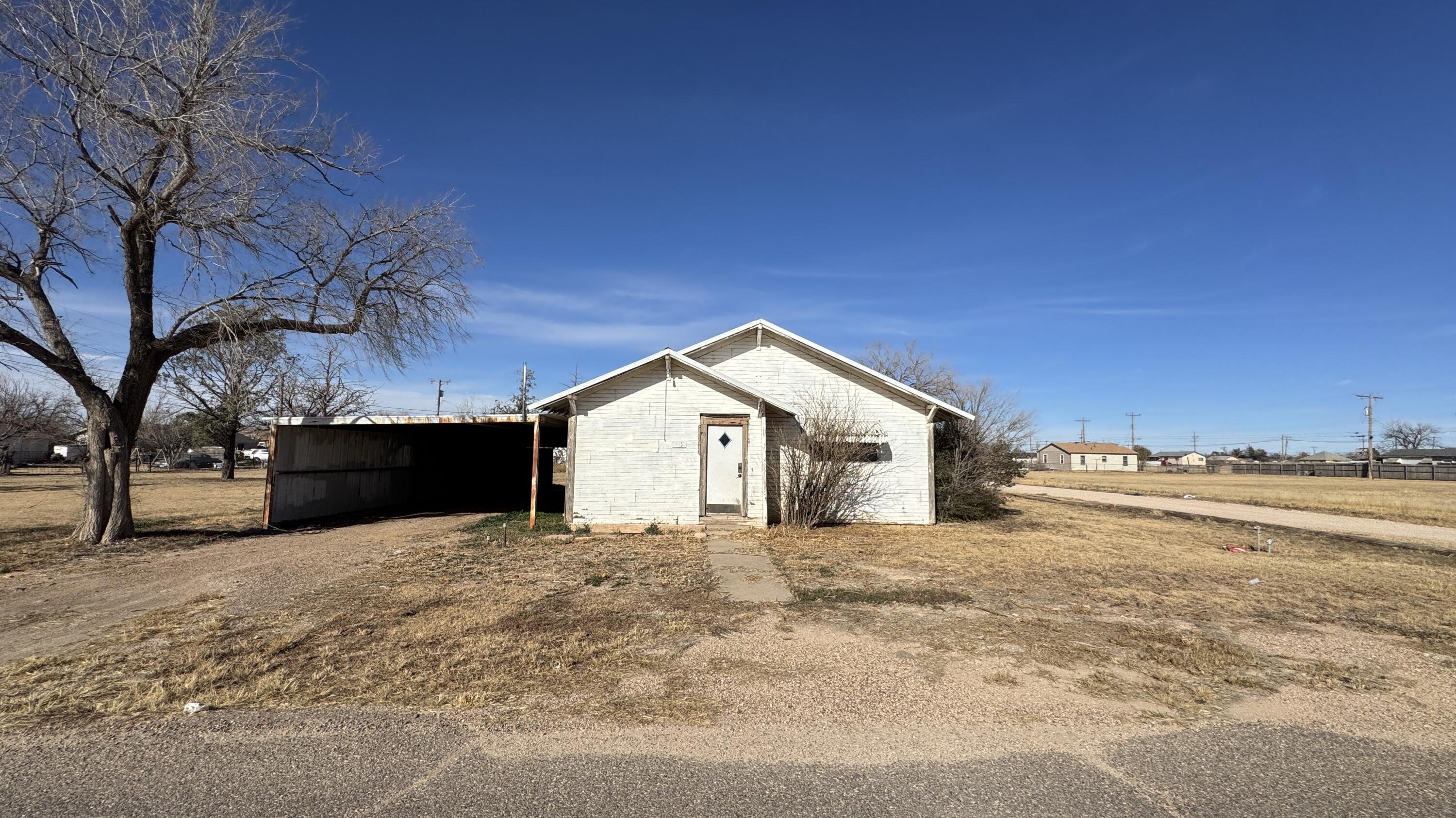 311 11th Street Ralls, TX 79357 - Photo 1 of 21 a view of a house with a yard