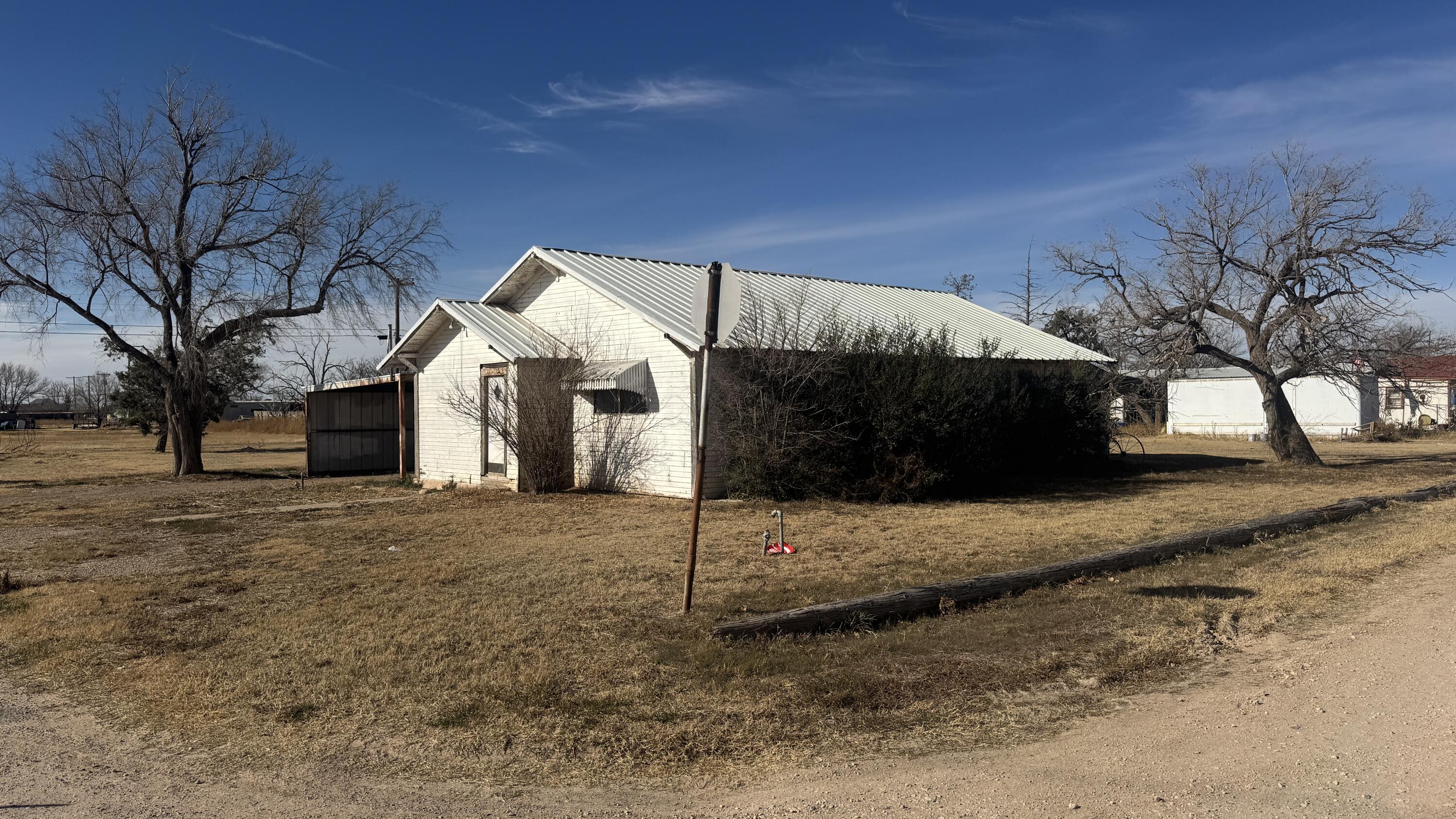 311 11th Street Ralls, TX 79357 - Photo 3 of 21 a view of a house with a yard