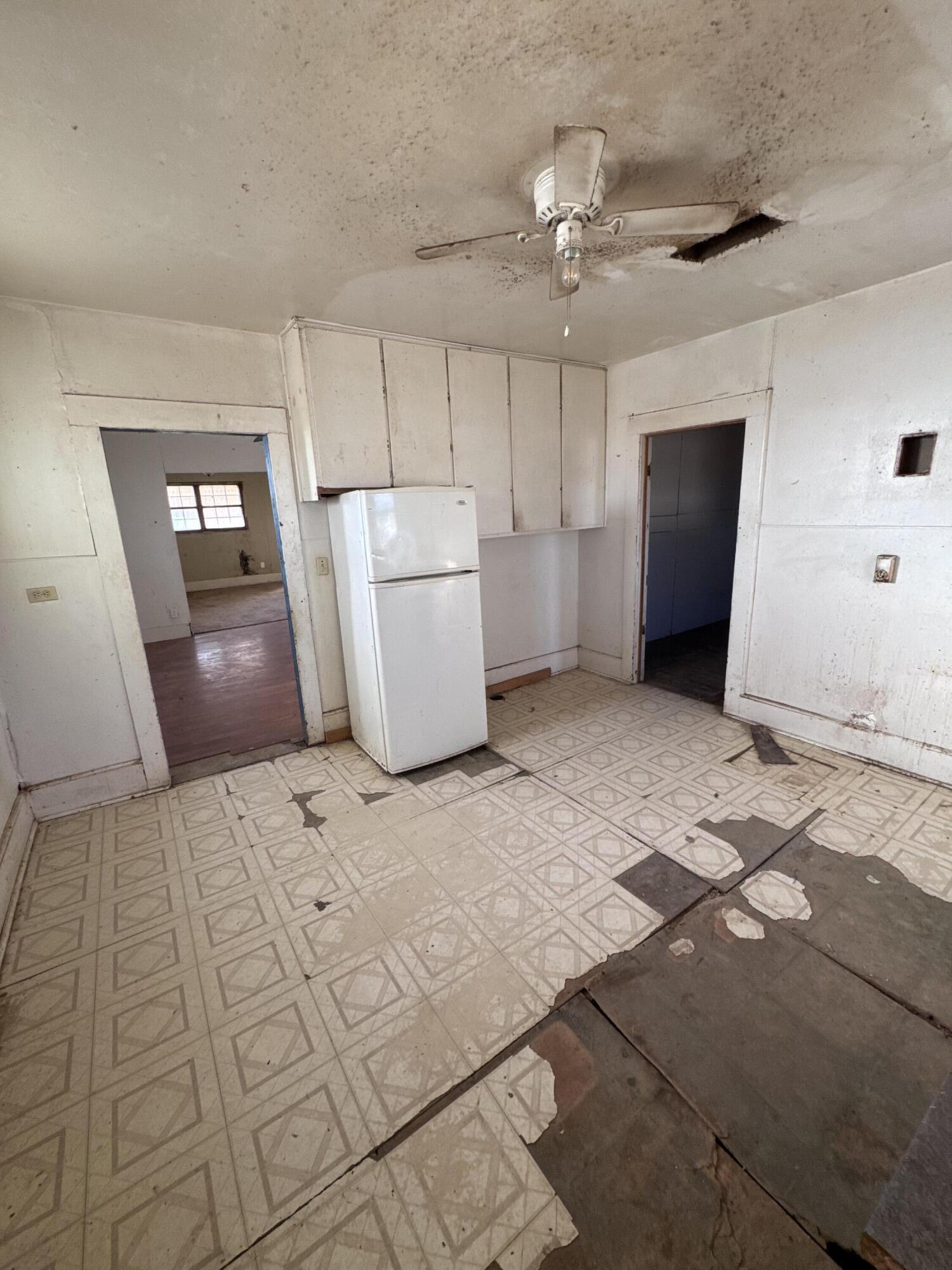 311 11th Street Ralls, TX 79357 - Photo 5 of 21 a view of a storage & utility room with a sink