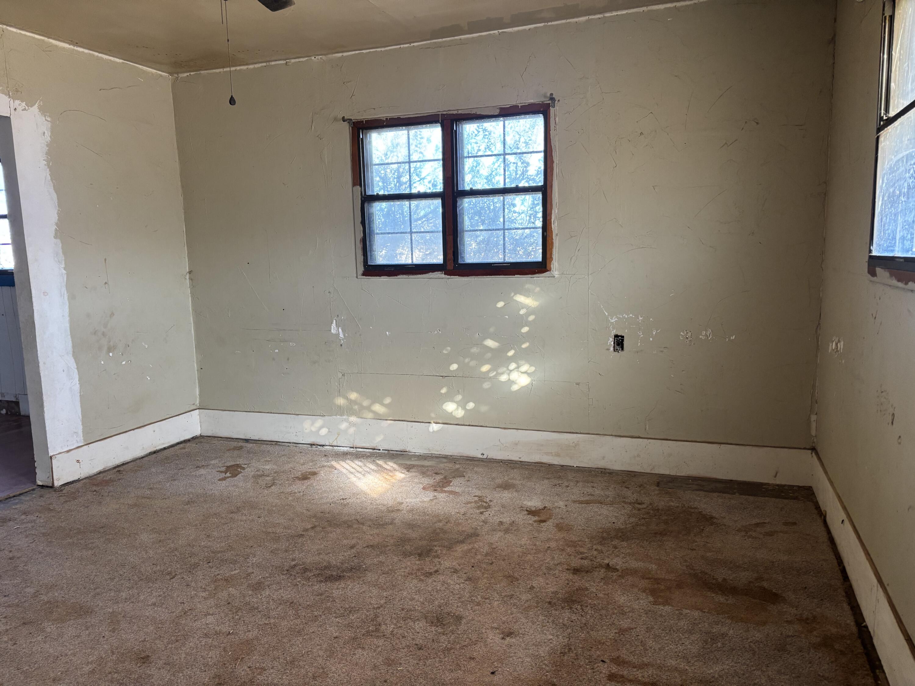 311 11th Street Ralls, TX 79357 - Photo 8 of 21 a view of an empty room with a window