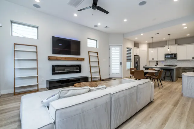 a kitchen with a sink stainless steel appliances and counter space