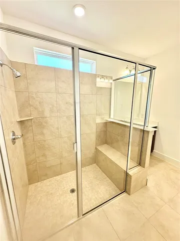 a bathroom with a double vanity sink and mirror