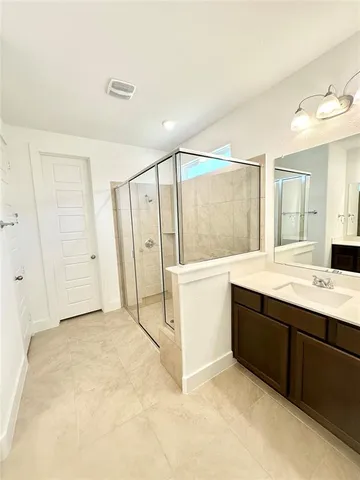 a bathroom with a sink double vanity and a mirror