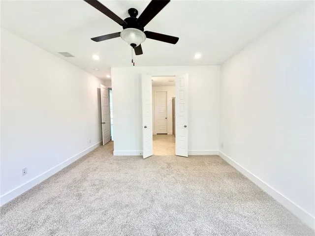 a bathroom with a bathtub sink mirror and a shower
