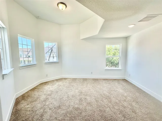 a bathroom with a sink a toilet a mirror and shower