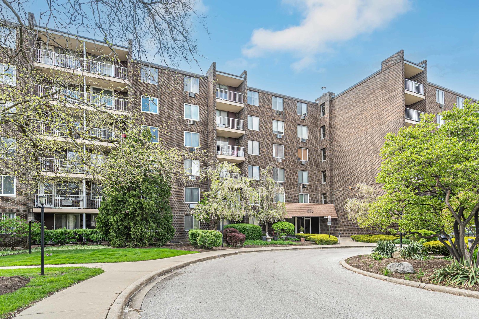 a city street lined with buildings and trees