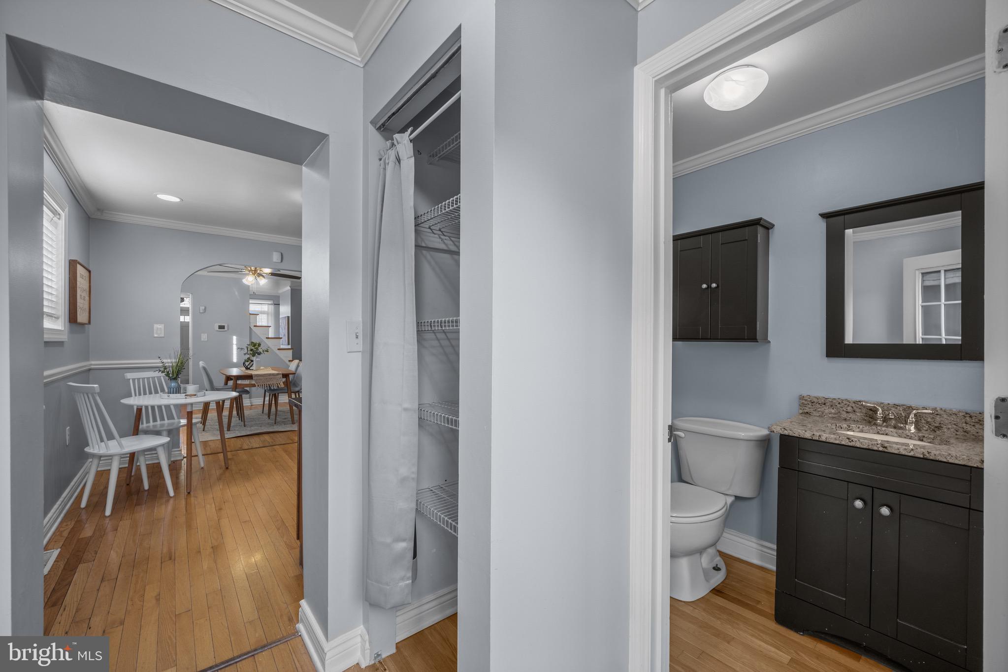 17 West Fort Avenue Baltimore, MD 21230 - Photo 15 of 43 a living room with furniture a flat screen tv and a toilet