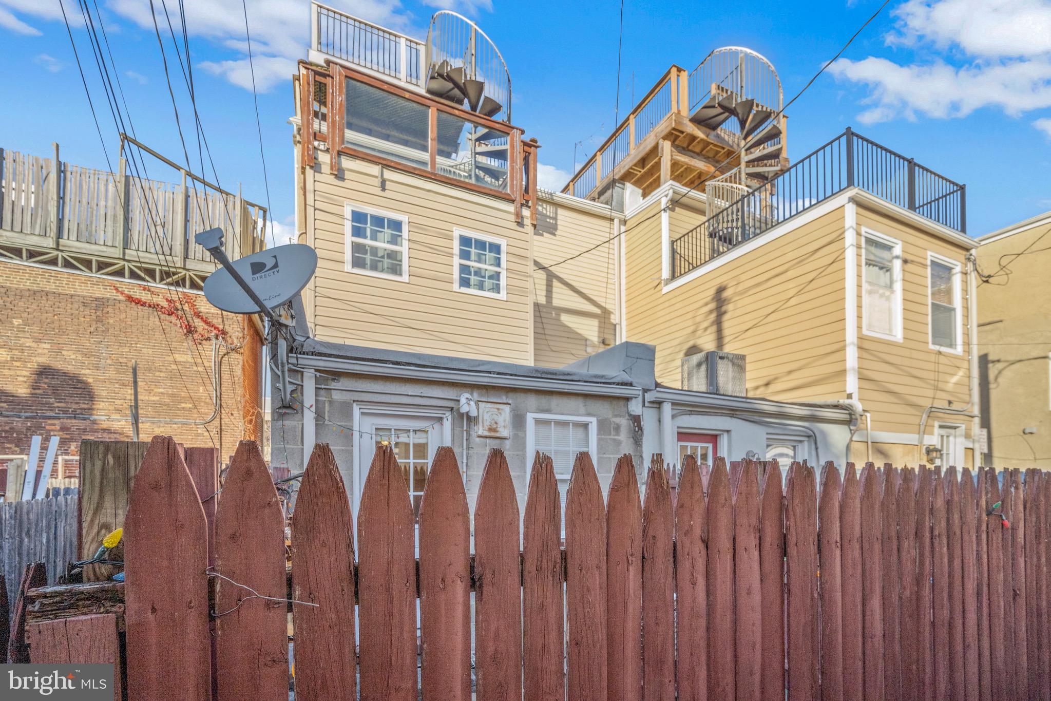 17 West Fort Avenue Baltimore, MD 21230 - Photo 19 of 43 a view of a house with a wooden fence