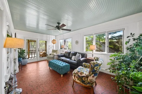 a bedroom with a bed window and a table