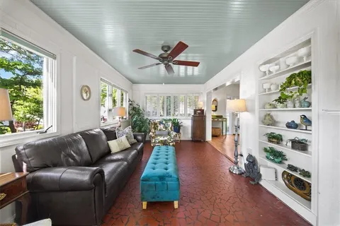 a bathroom with a sink mirror and toilet