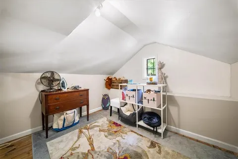 a balcony with view of balcony and wooden floor