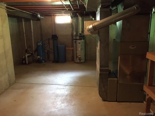 4833 Clements Circle Howell, MI 48855 - Photo 18 of 27 mechanicals and unfinished basement storage space