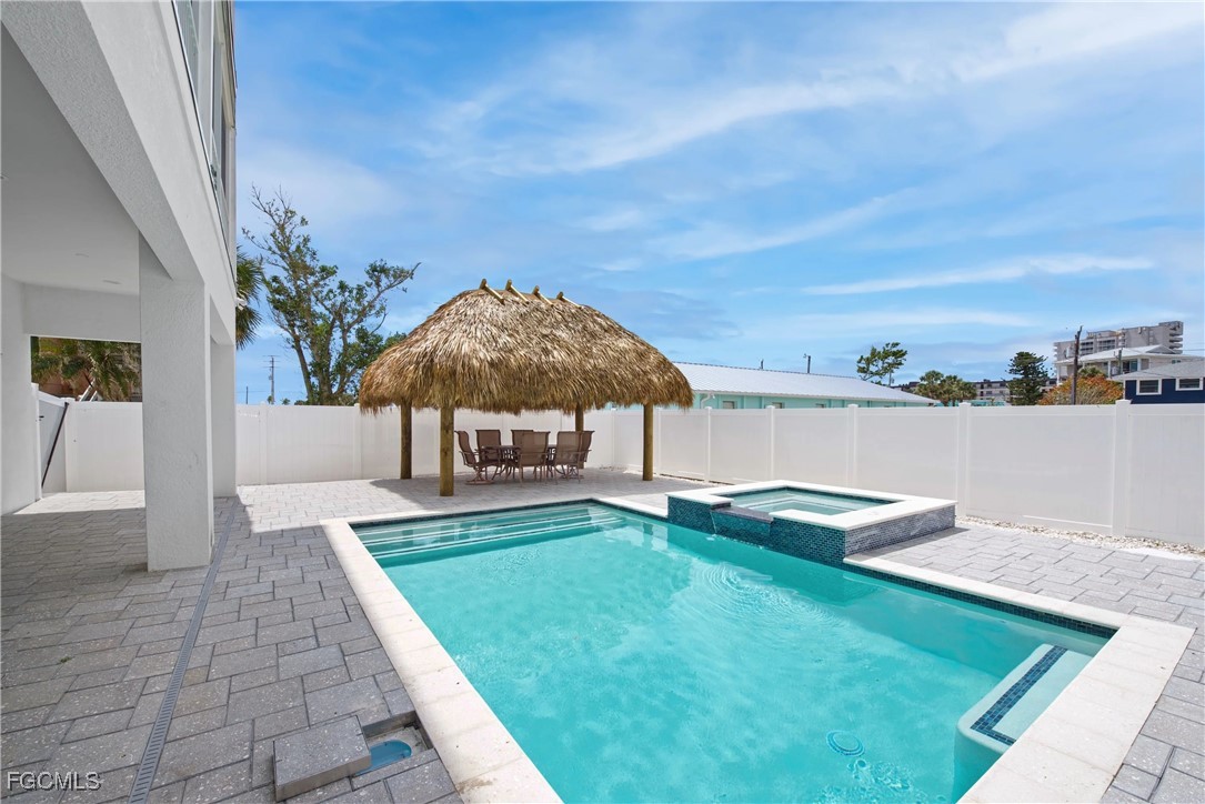151 Chapel Street Fort Myers Beach, FL 33931 - Photo 2 of 23 a view of a house with backyard and sitting area