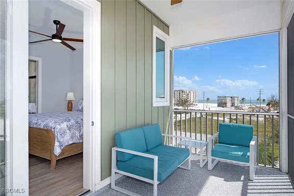 a bedroom with furniture and a window