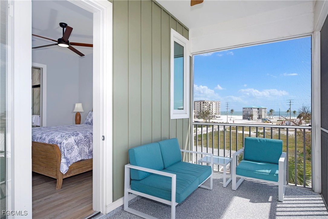 151 Chapel Street Fort Myers Beach, FL 33931 - Photo 8 of 23 a bedroom with furniture and a window