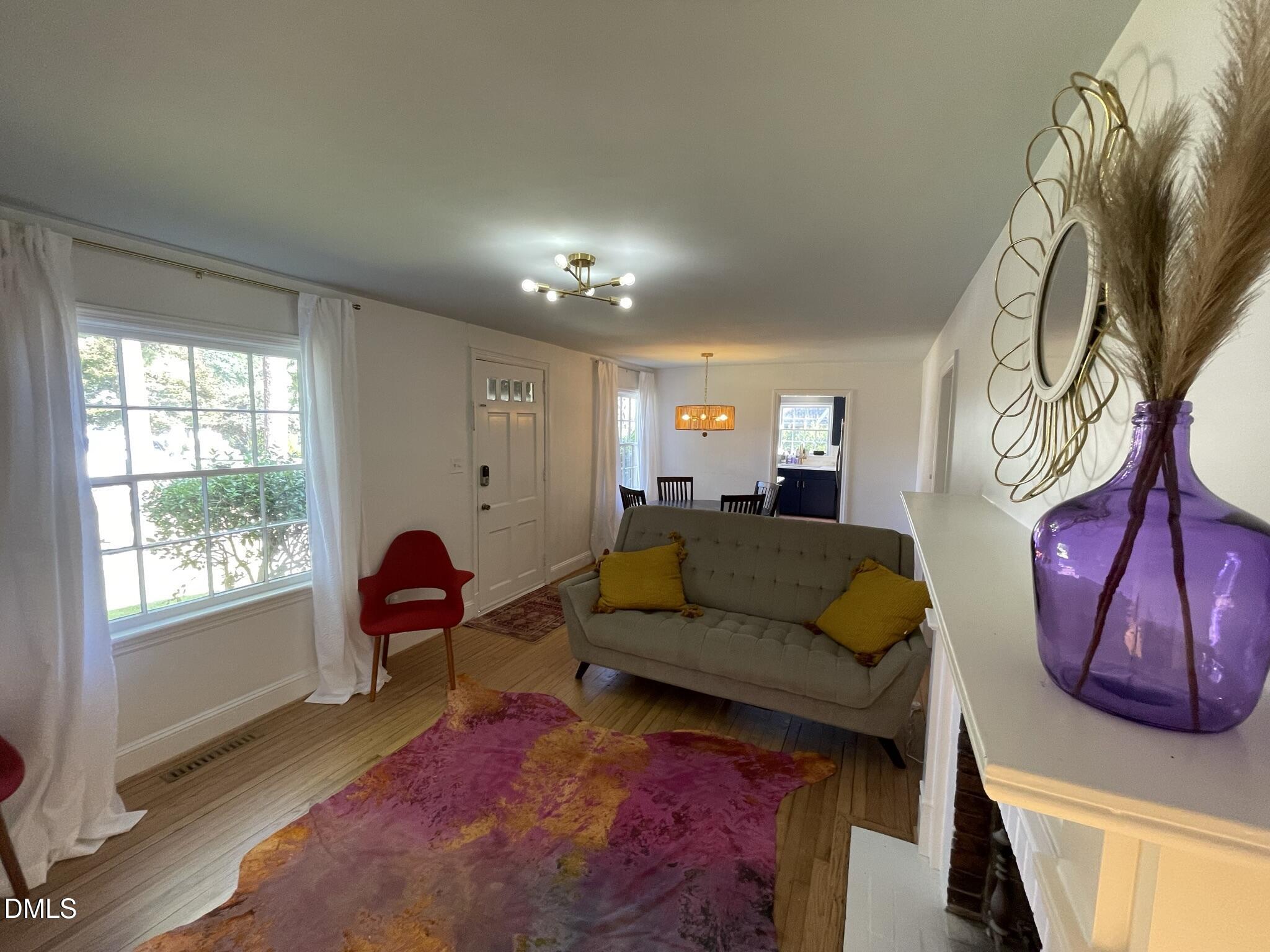 1009 Canterbury Road Raleigh, NC 27607 - Photo 30 of 31 a living room with furniture and a window
