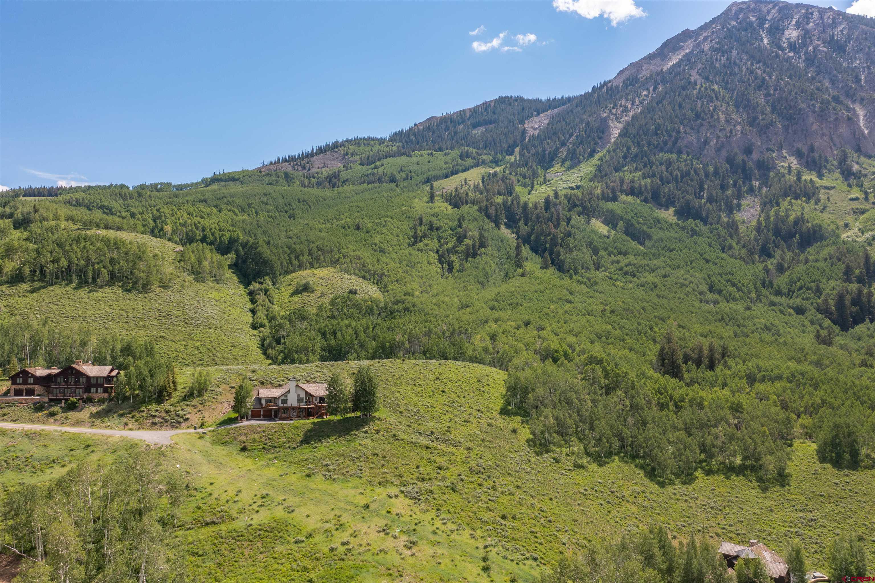 35 Overlook Drive Crested Butte, CO 81225 - Photo 8 of 22 a view of a lush green hillside and houses