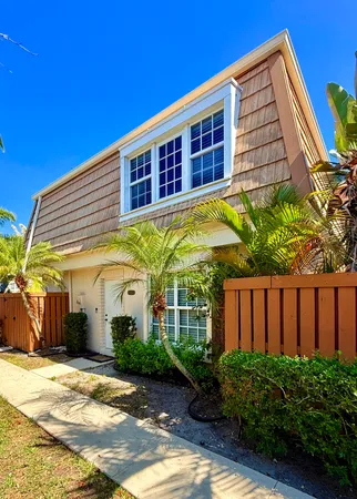 a view of a building next to a yard