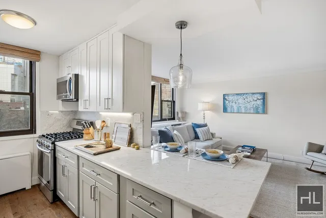 a kitchen with sink and stove