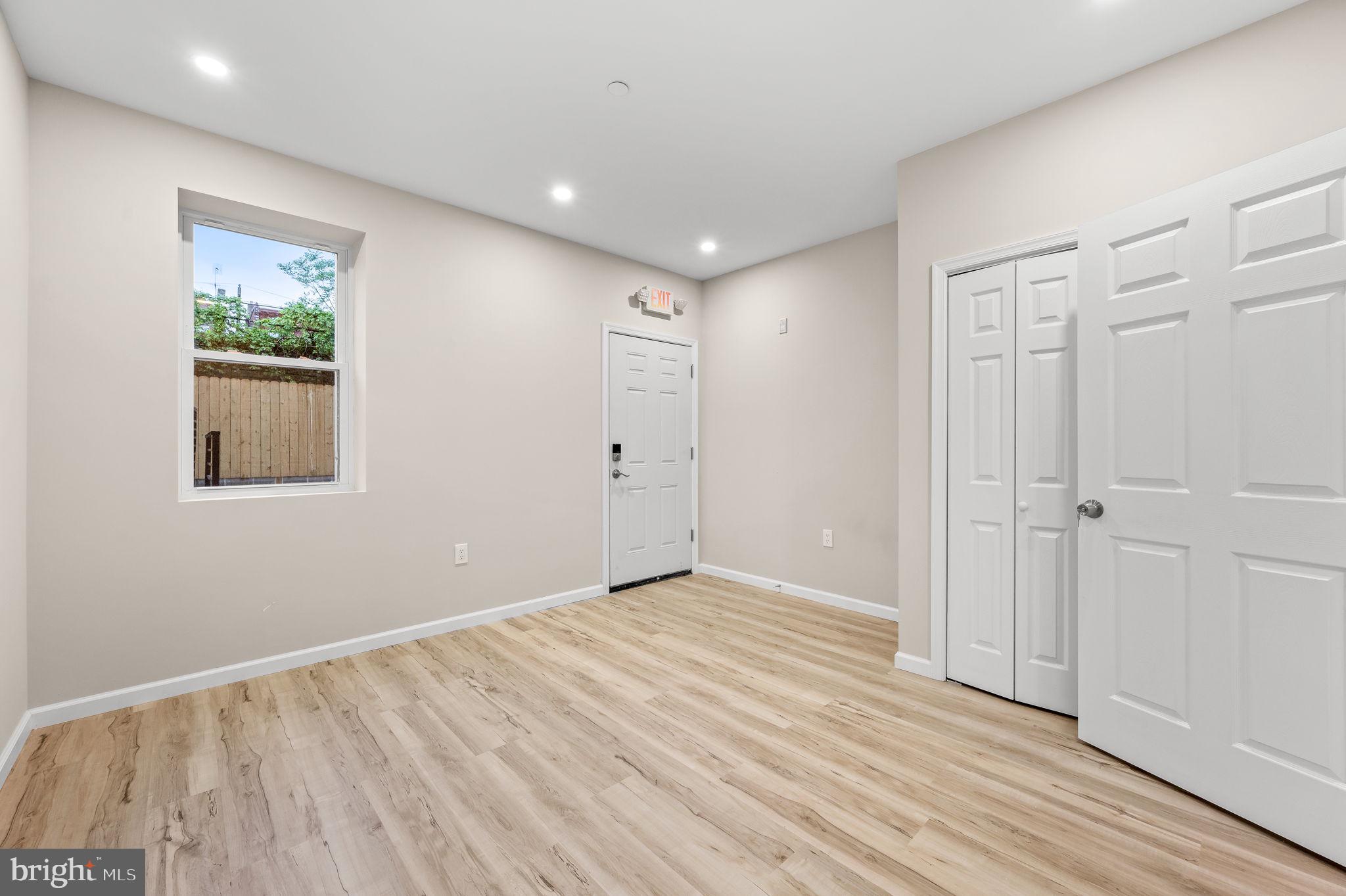 2134 North 19th Street, Unit 1 Philadelphia, PA 19121 - Photo 3 of 10 a view of empty room with wooden floor and fan
