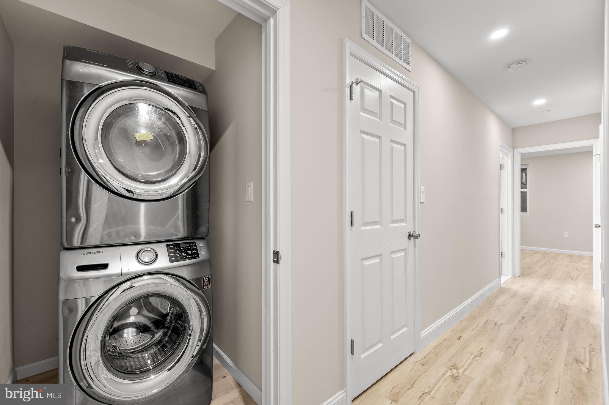2134 North 19th Street, Unit 1 Philadelphia, PA 19121 - Photo 7 of 10 a view of a hallway with washer and dryer