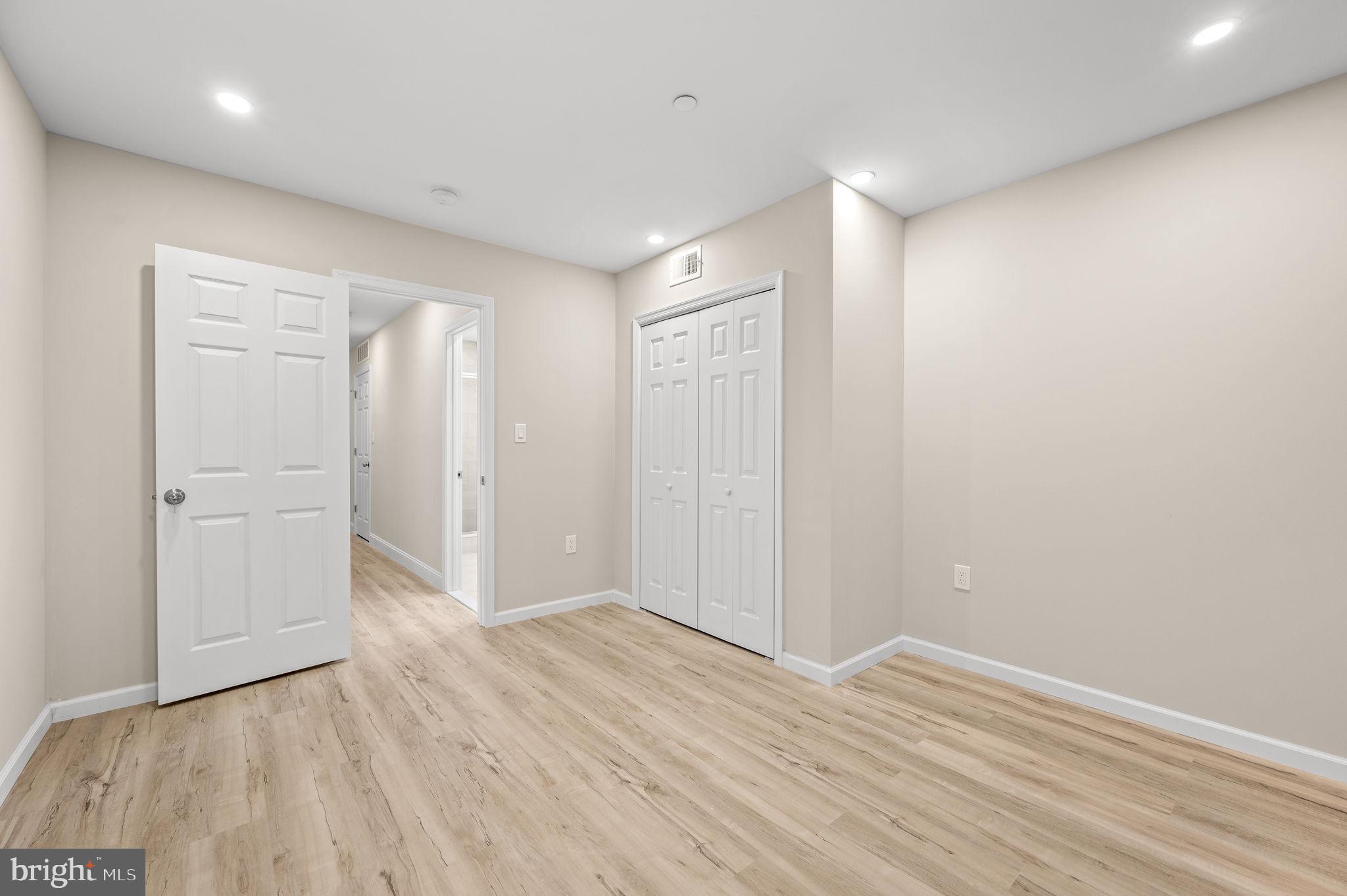 2134 North 19th Street, Unit 1 Philadelphia, PA 19121 - Photo 8 of 10 a view of an empty room with wooden floor