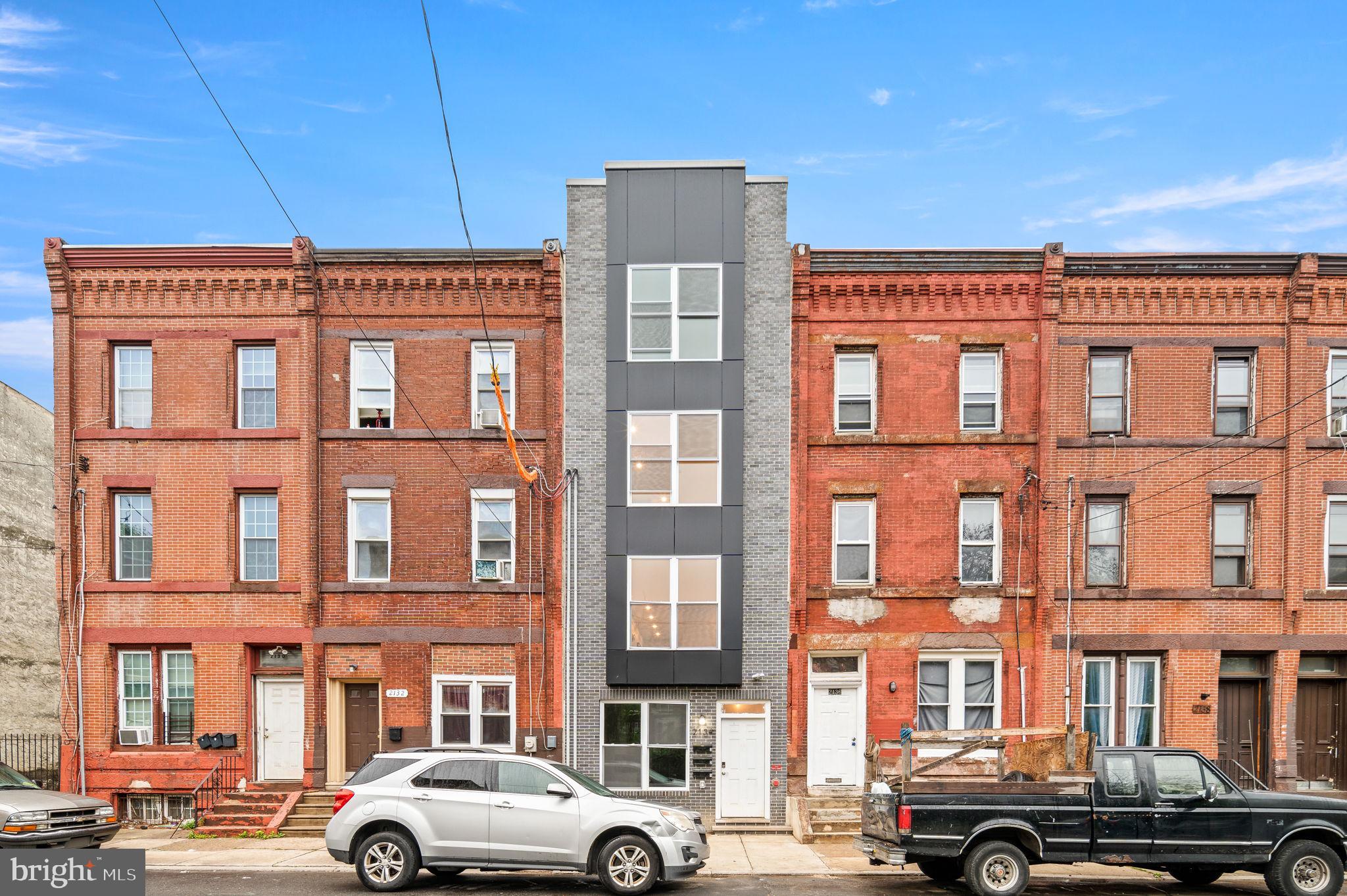 2134 North 19th Street, Unit 1 Philadelphia, PA 19121 - Photo 10 of 10 a front view of a building with parking space