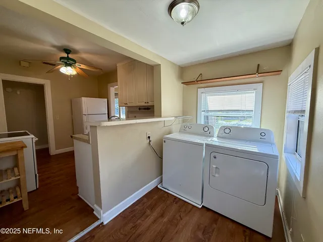 a kitchen with a sink appliances and cabinets