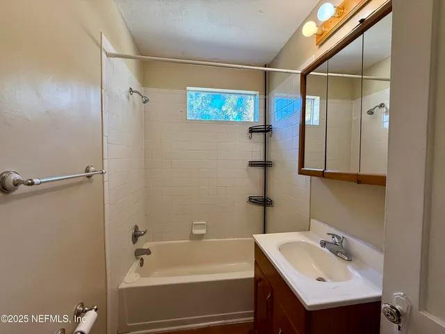 a bathroom with a sink and a bathtub