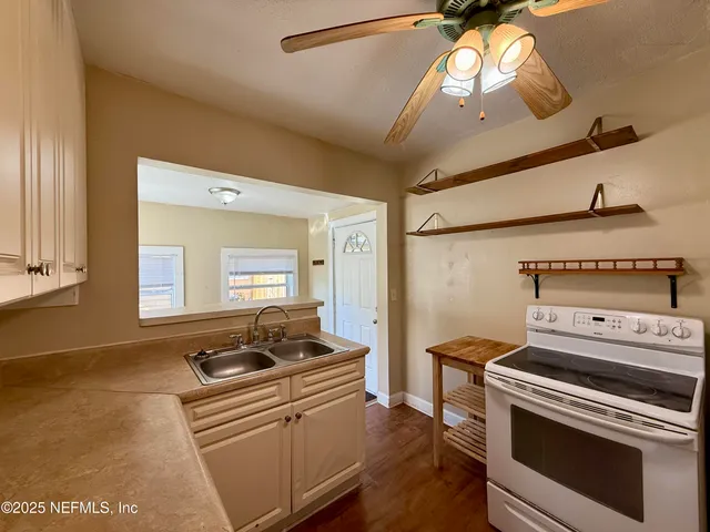 a kitchen with a stove and a microwave