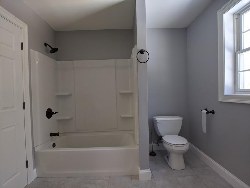 95 Babcock Tavern Road Ware, MA 01082 - Photo 23 of 31 a bathroom with a toilet and a shower
