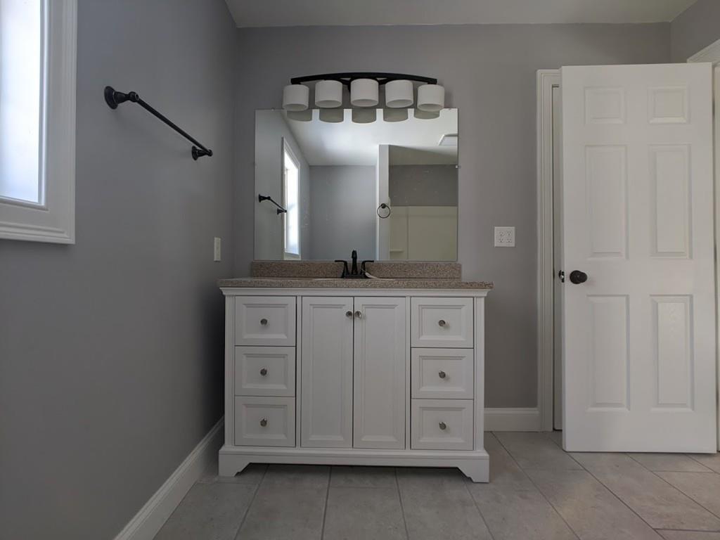 95 Babcock Tavern Road Ware, MA 01082 - Photo 24 of 31 a bathroom with a granite countertop sink and a mirror