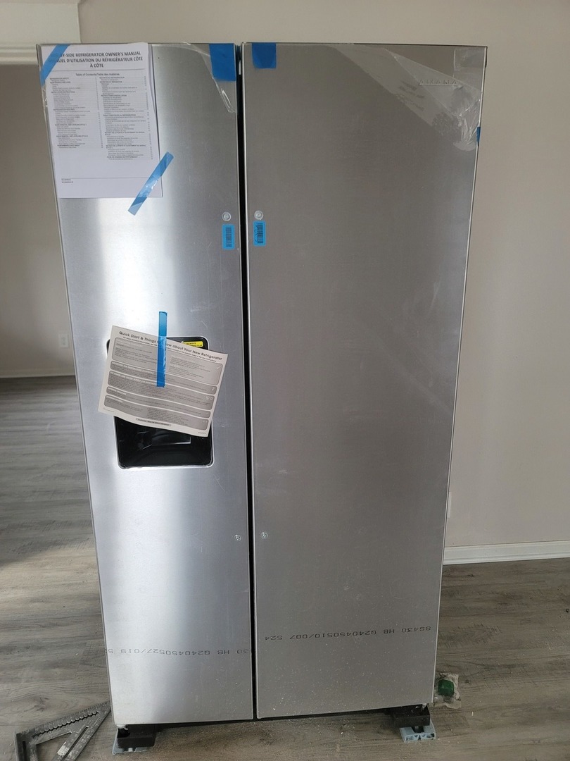 550 5th Avenue Aurora, IL 60505 - Photo 7 of 10 a white refrigerator freezer sitting inside of a kitchen