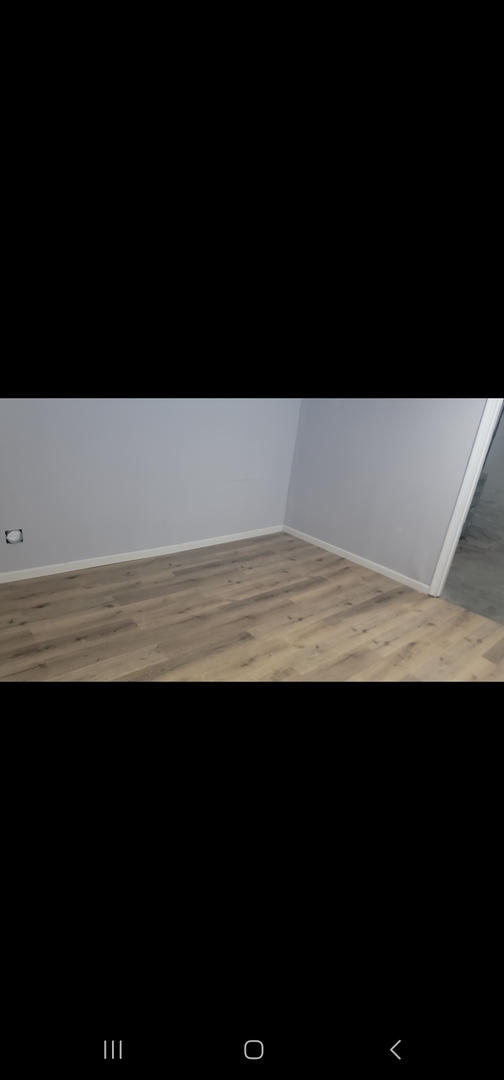 550 5th Avenue Aurora, IL 60505 - Photo 8 of 10 a view of an empty room and kitchen floor
