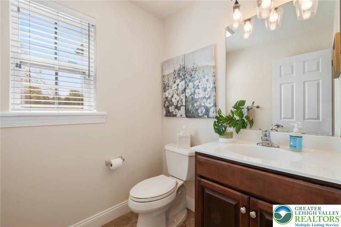 208 East Dell Road Bath, PA 18014 - Photo 19 of 40 a bathroom with a sink a toilet and a mirror