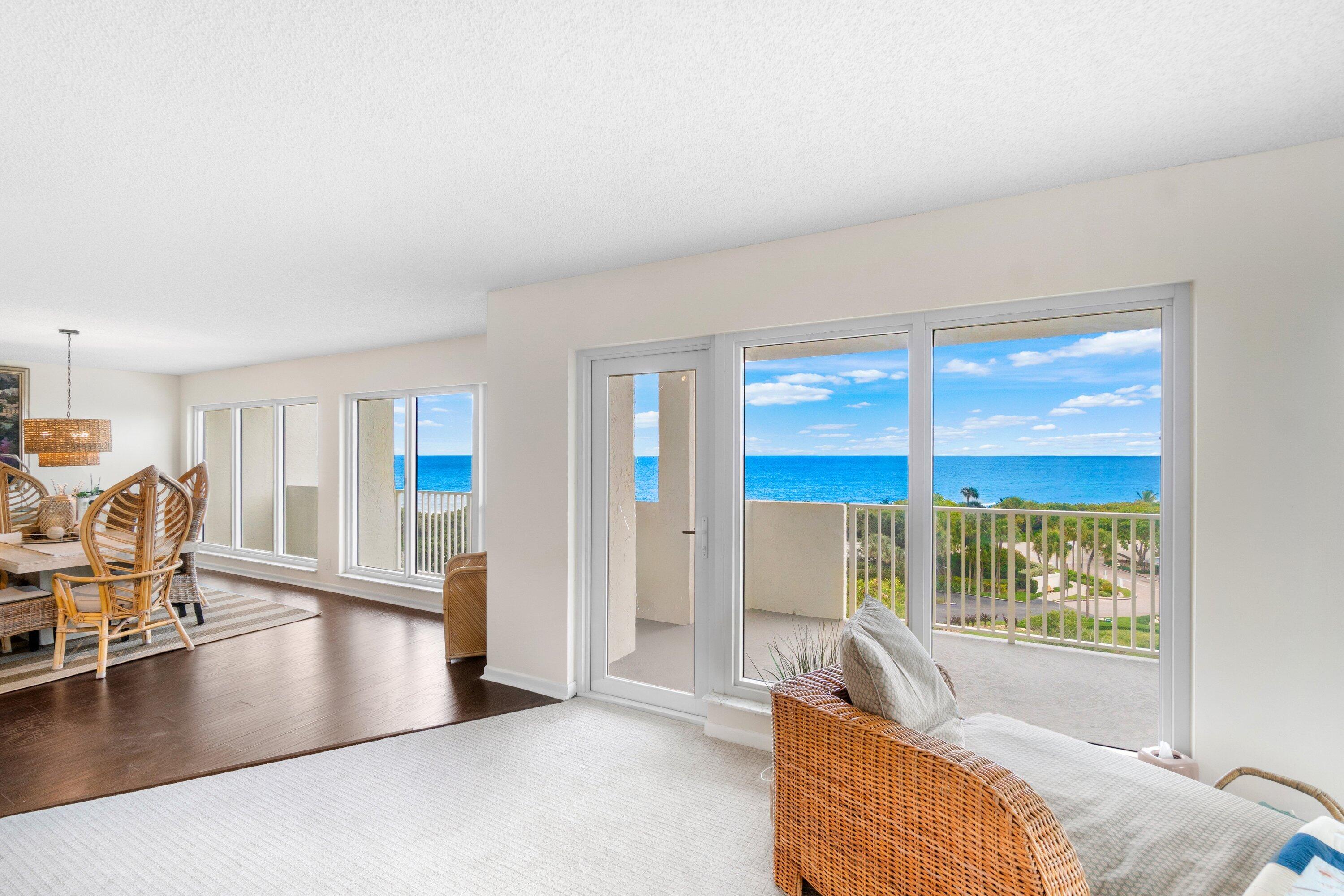 4301 North Ocean Boulevard, Unit 708 Boca Raton, FL 33431 - Photo 11 of 51 a living room with furniture and large windows