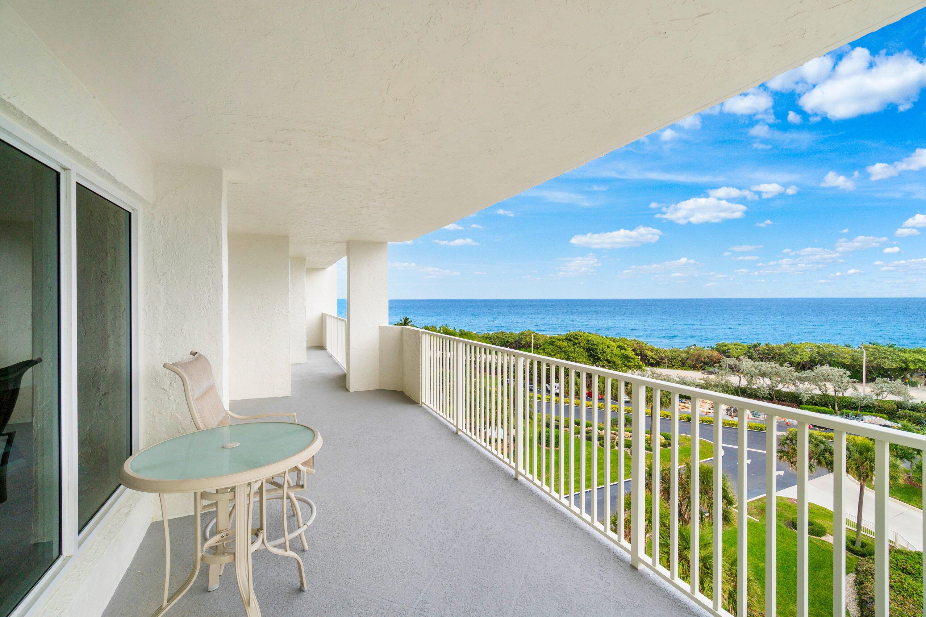 4301 North Ocean Boulevard, Unit 708 Boca Raton, FL 33431 - Photo 14 of 51 a view of a chairs and table on the balcony