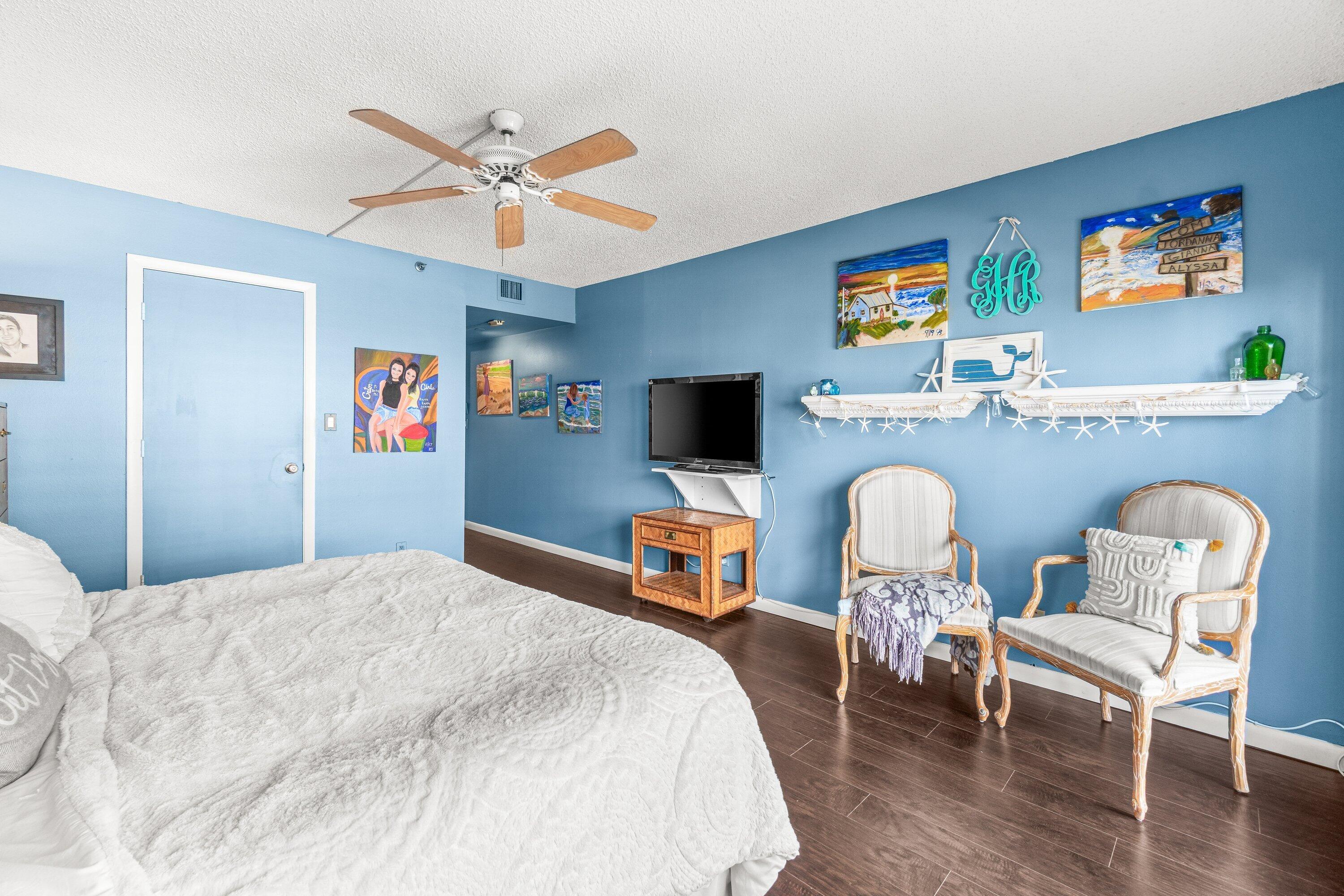 4301 North Ocean Boulevard, Unit 708 Boca Raton, FL 33431 - Photo 24 of 51 a bedroom with a bed and a chair